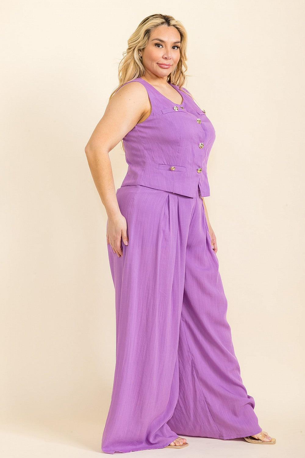 Purple Set of top with golden details and wide leg pants seen from the side